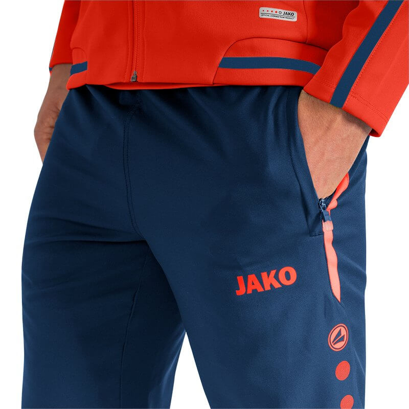 JAKO-6519-18-5 Leisure Pants Striker 2.0 Navy/Flame Zipped Side Pockets